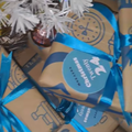 Christmas gifts wrapped in Checkers Sixty60 paper bags