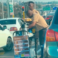 Man sells coffee at traffic light