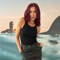 Dua Lipa wearing a black skirt and top