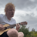 Ed Sheeran playing a guitar
