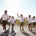 Elementary school kids having fun at the school playground