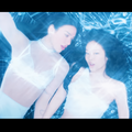 Jennie and Dua Lipa wearing matching white outfits