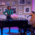 Jennifer Hudson looking at John Legend singing at the piano