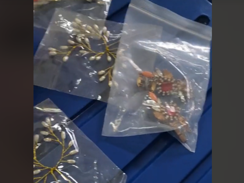 Jewellery pieces in plastic bags lying in the garbage