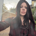 Lady Gaga taking a selfie outdoors