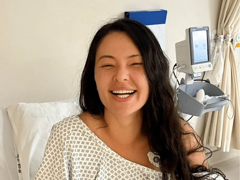Lalla Hirayama sitting in a hospital bed