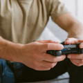 Man playing video games with game controller