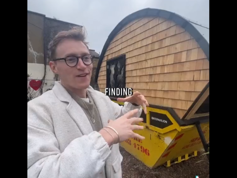 Man standing next to his skip home