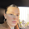 Millie Bobby Brown sitting in a car