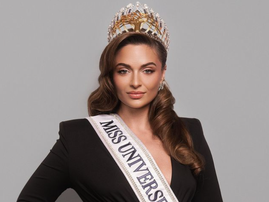 Miss South Africa Mia Le Roux wearing her crown and Miss Universe sash