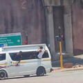 People hanging out of a taxi window in Durban