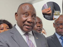 President Ramaphosa looks shocked as he holds a jar of Marijuana