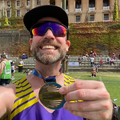 Rory Petzer poses in Cape Town with his Two Oceans Marathon medal