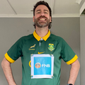 Rory Petzer wearing a Springbok t shirt with an FNB sign