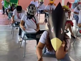 Students wearing funny hats while writing their examinations