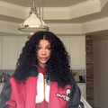 SZA poses in a kitchen