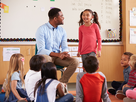 Teacher in a classroom with kids