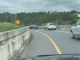 Vehicles try to reverse from an off ramp onto the N2 highway