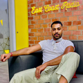 Vic Naidoo sitting at the East Coast Radio house reception