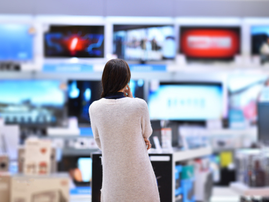 Woman buying a television