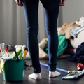 Woman horrified by mess in her apartment
