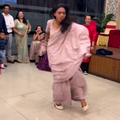 Young woman wearing saree dancing